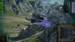Tank angled behind rocks